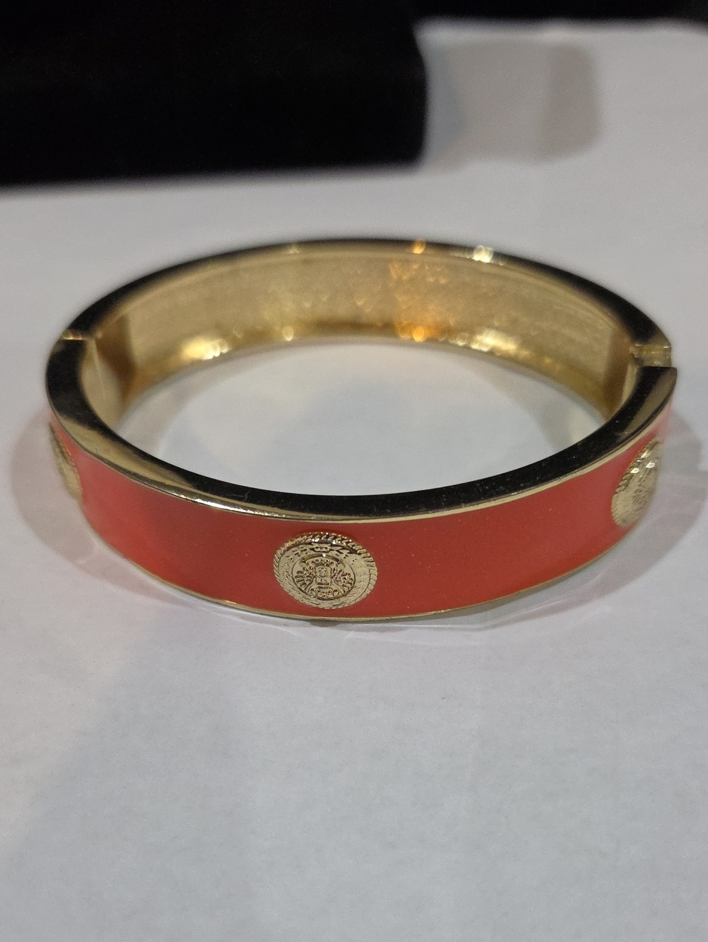 GOLDTONE AND ORANGE ENAMEL HINGED BRACELET